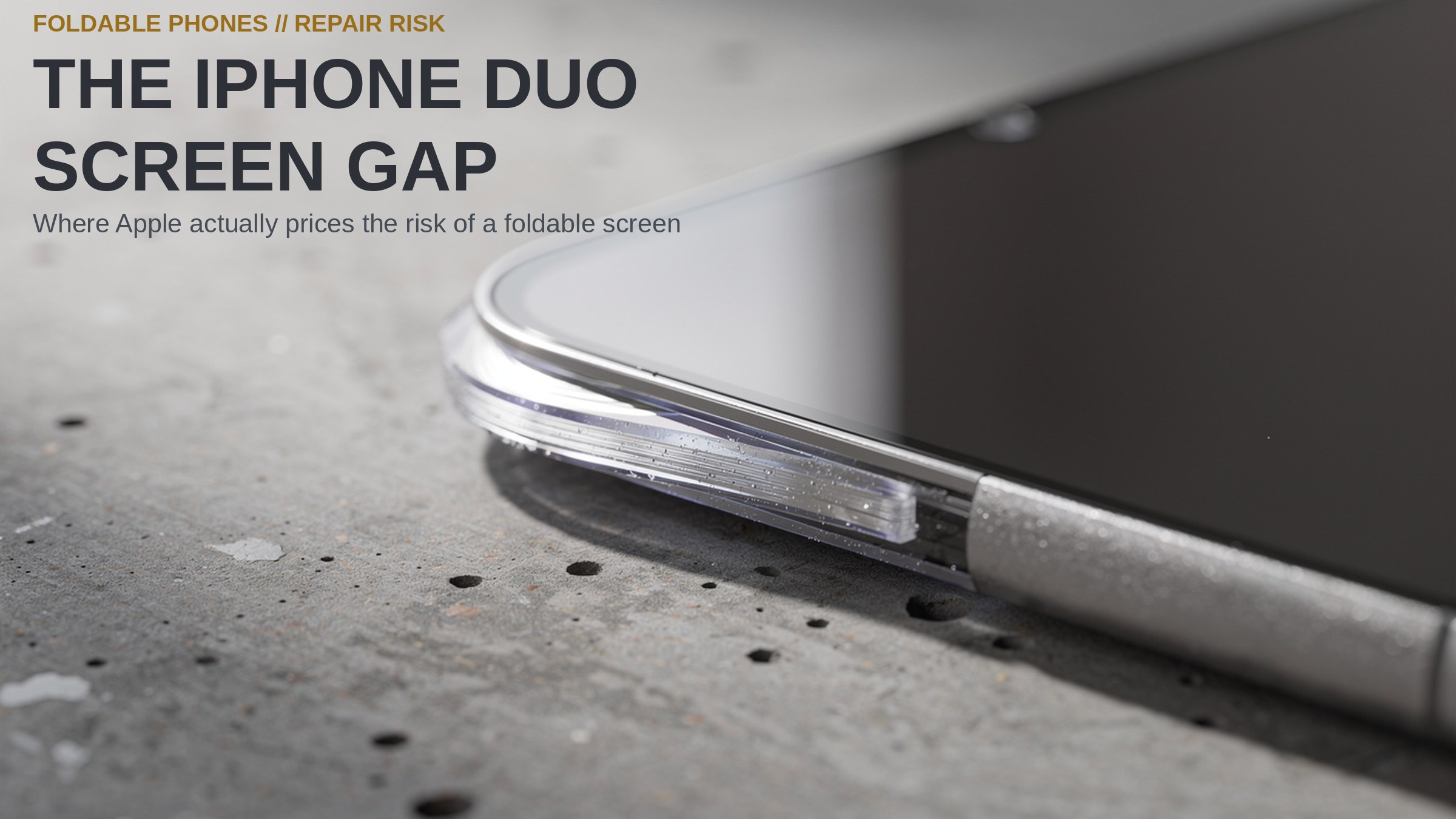 The iPhone Duo Screen Gap. Close-up of a foldable smartphone screen edge showing bonded glass layers on a concrete surface.